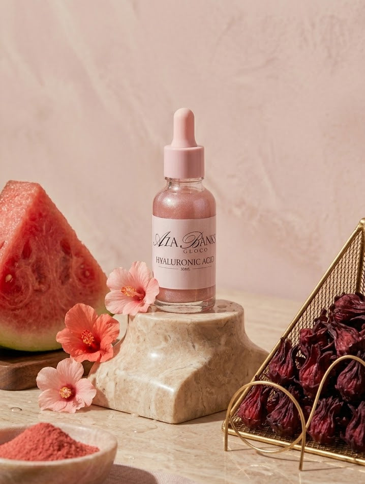 Bottle of skincare serum with watermelon, flowers, and hawthorn berries on a neutral background